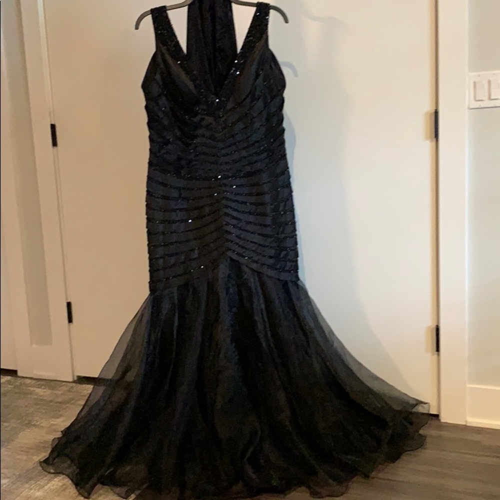 Black woman’s formal gown.